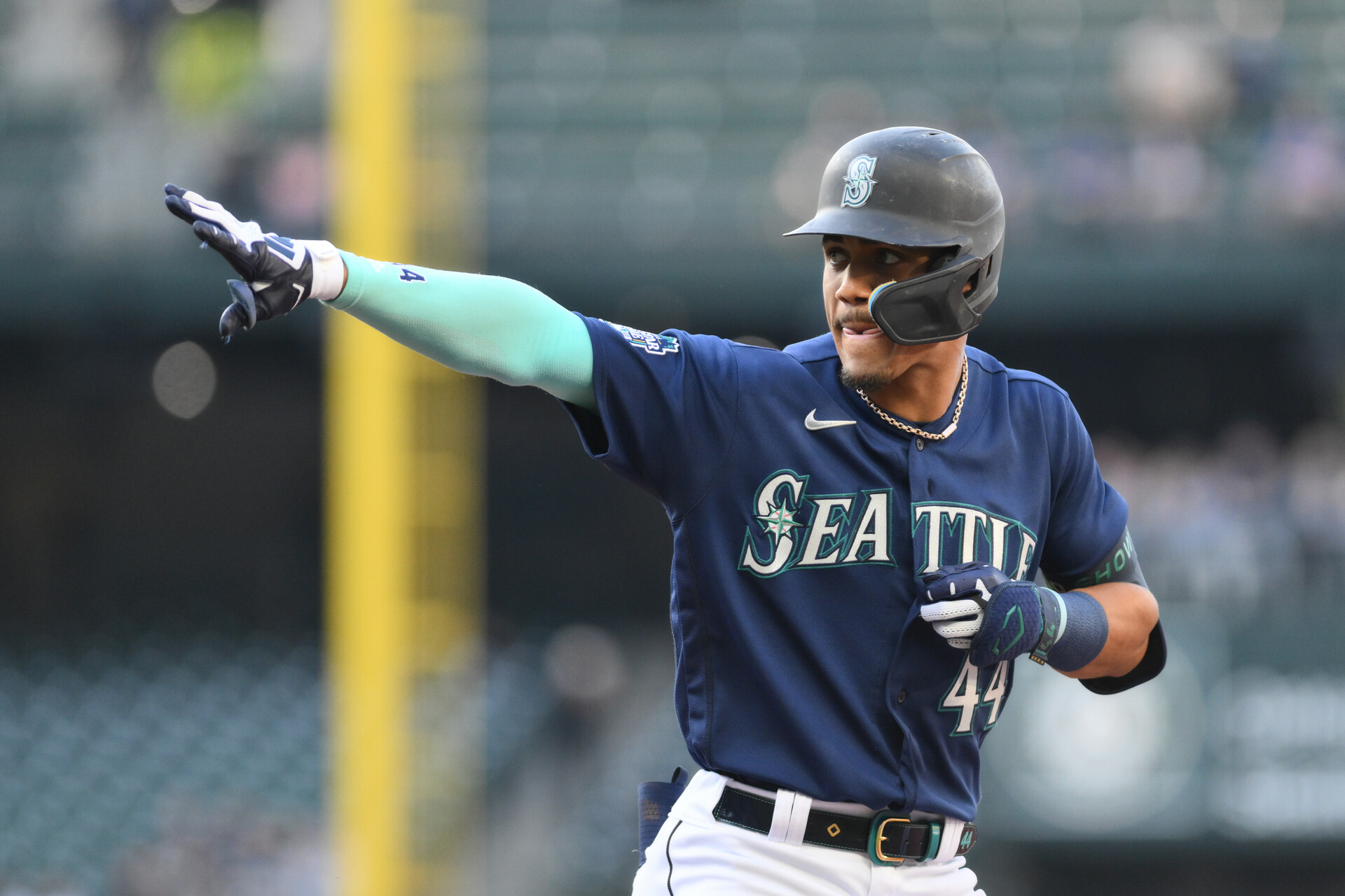 Seattle Mariners center fielder Julio Rodriguez (44) points to the dugout after hitting a single against the Oakland Athletics during the second inning at T-Mobile Park.
