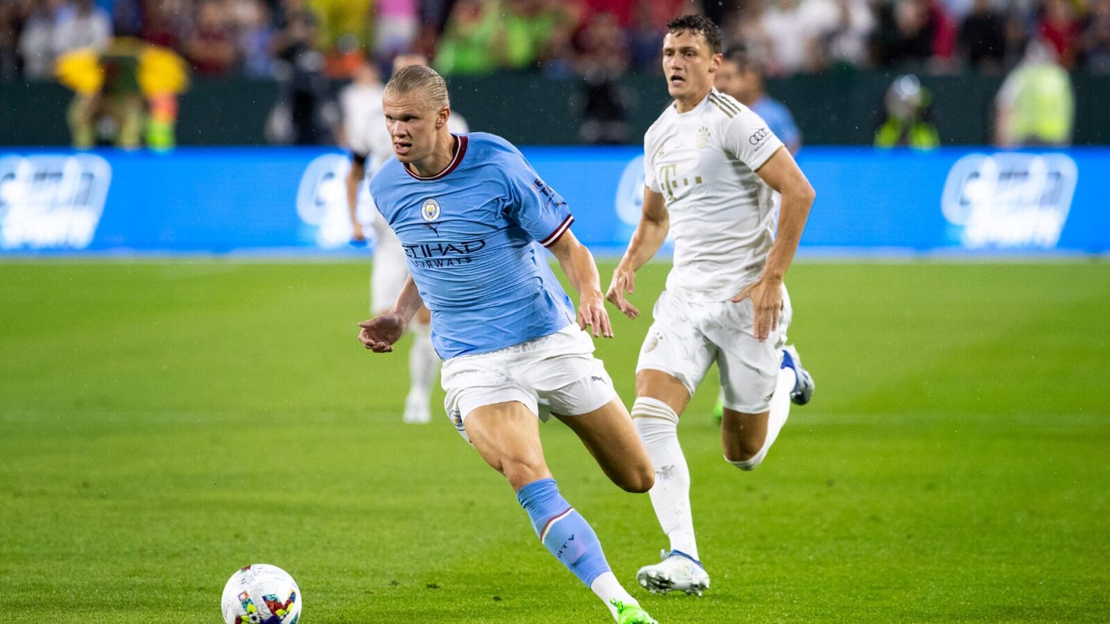Manchester City forward Erling Haaland (9) runs the ball during the exhibition match against FC Bayern Munich on Saturday, July 23, 2022, at Lambeau Field in Green Bay, Wis.