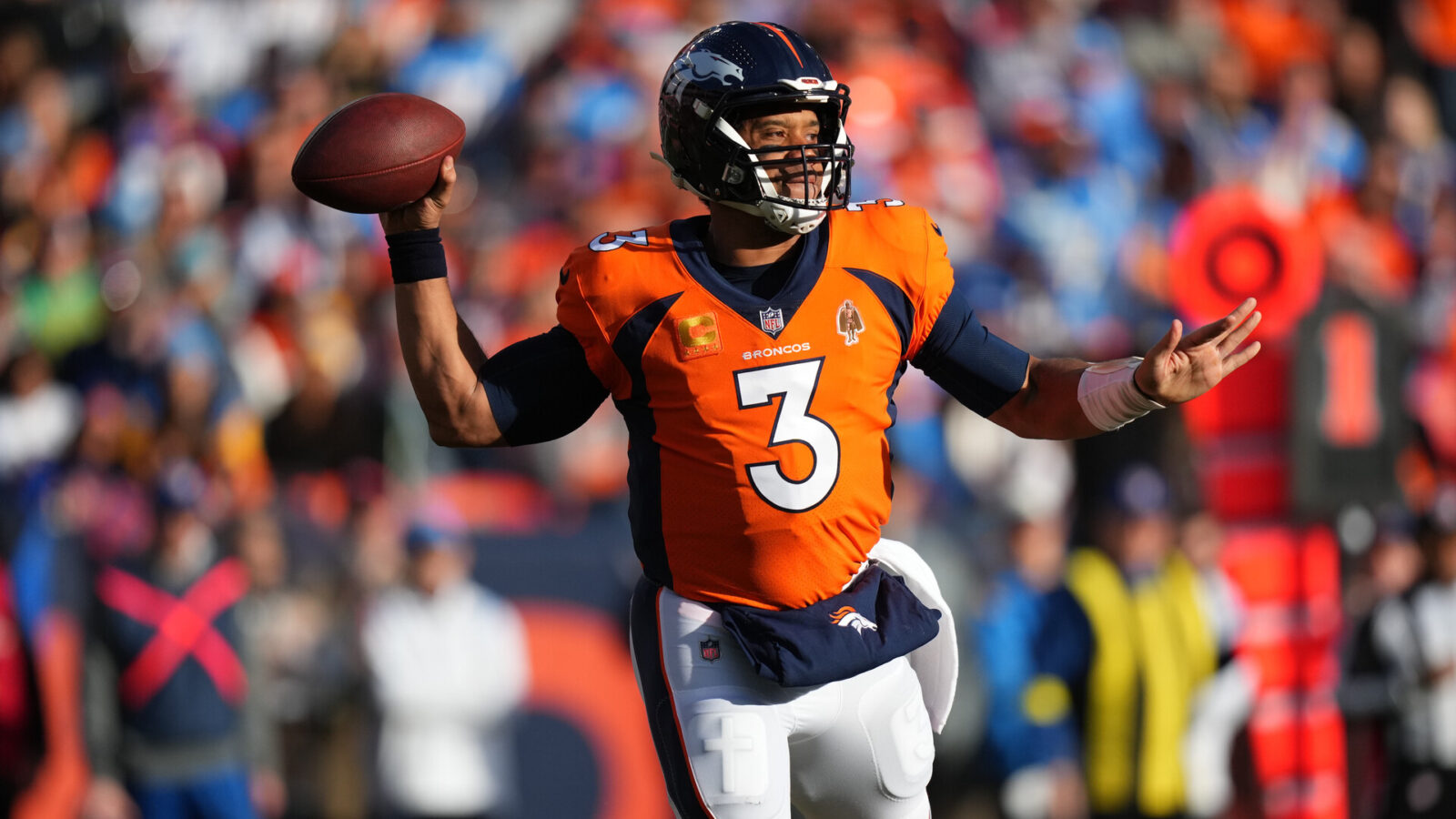 Jan 8, 2023; Denver, Colorado, USA; Denver Broncos quarterback Russell Wilson (3) prepares to pass in the first quarter against the Los Angeles Chargers at Empower Field at Mile High.