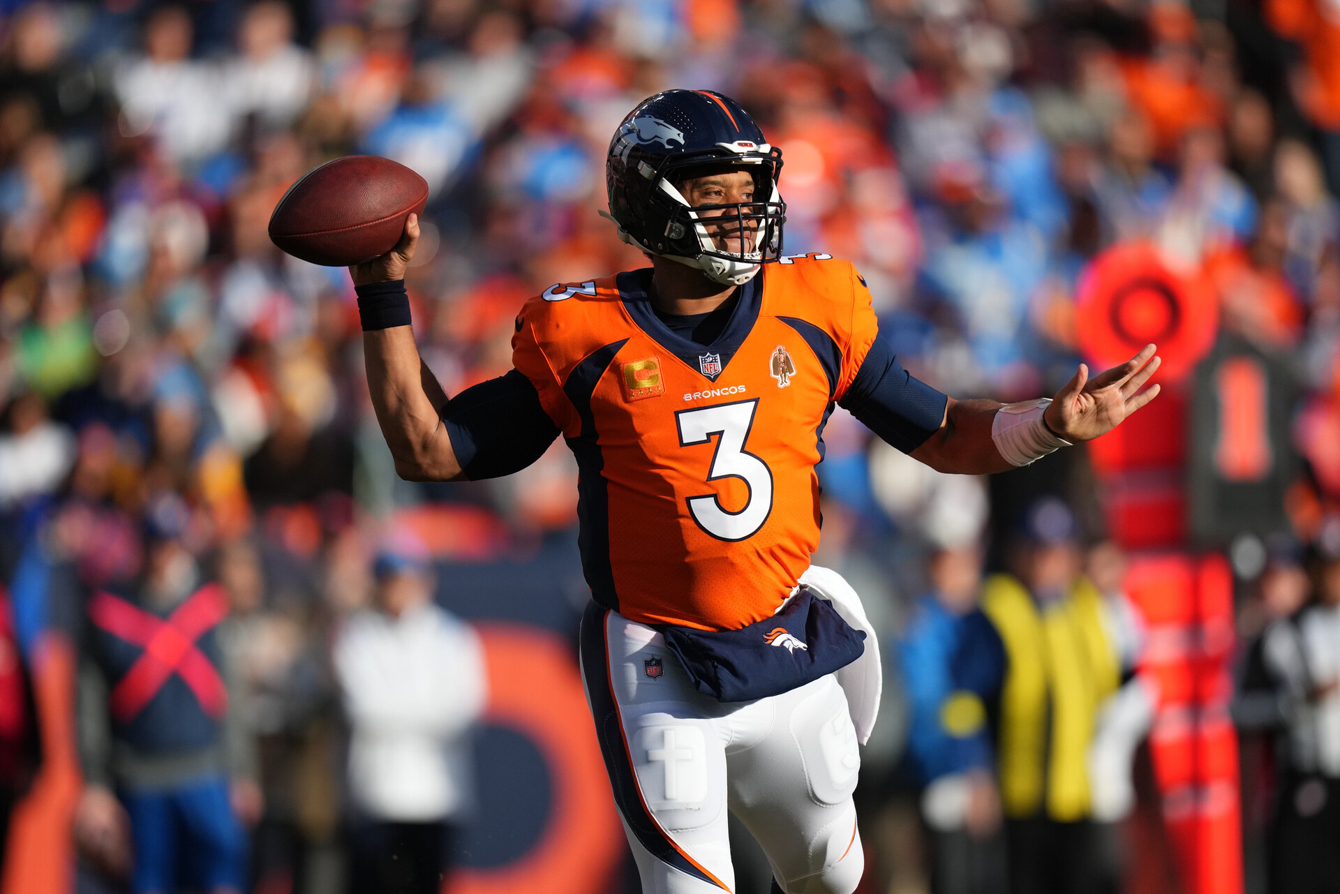 Jan 8, 2023; Denver, Colorado, USA; Denver Broncos quarterback Russell Wilson (3) prepares to pass in the first quarter against the Los Angeles Chargers at Empower Field at Mile High.