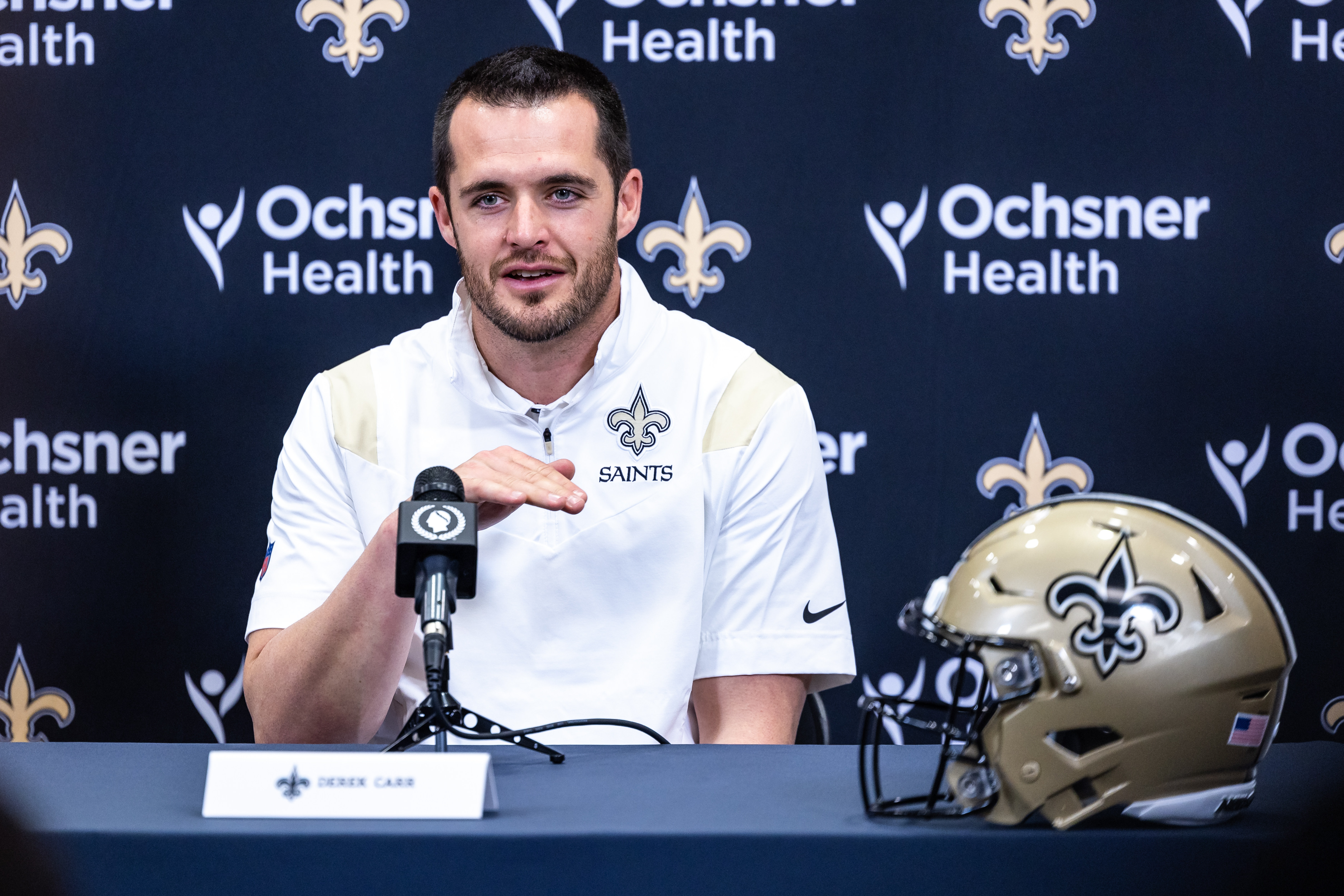 New Orleans Saints quarterback Derek Carr (4) speaks at Ochsner Sports Performance Center.