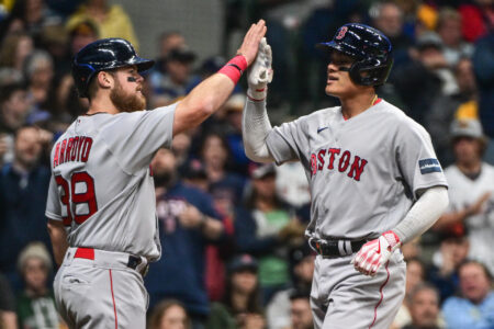 Apr 22, 2023; Milwaukee, Wisconsin, USA; Boston Red Sox shortstop Yu Chang (20) is greeted by second baseman Christian Arroyo (39) after hitting a 2-run homer in the fifth inning against the Milwaukee Brewers at American Family Field.