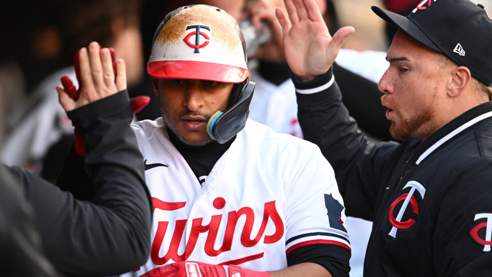 Minnesota Twins first baseman Donovan Solano (39) reacts with catcher Christian Vazquez (right) and teammates after scoring a run against the New York Yankees during the third inning at Target Field.