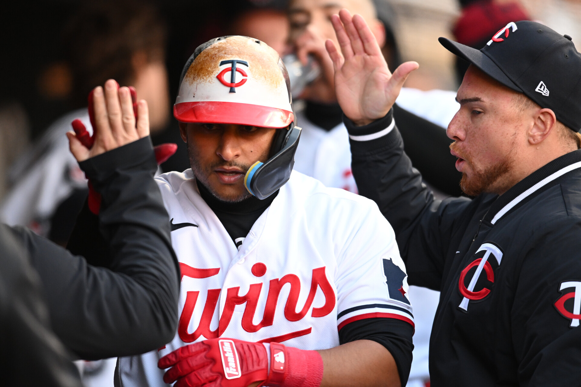 Minnesota Twins first baseman Donovan Solano (39) reacts with catcher Christian Vazquez (right) and teammates after scoring a run against the New York Yankees during the third inning at Target Field.