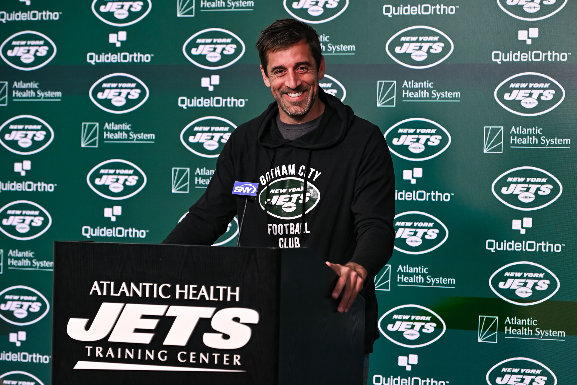 May 23, 2023; Florham Park, NJ, USA; New York Jets quarterback Aaron Rodgers (8) speaks at a press conference after practice at Atlantic Health Jets Training Center.
