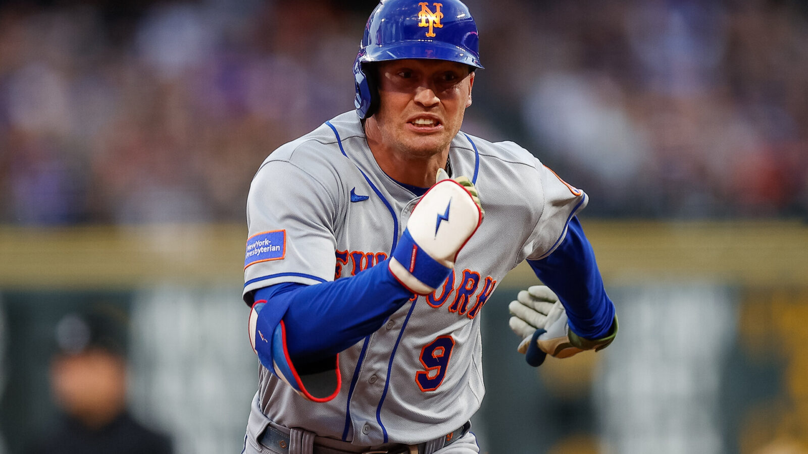 New York Mets center fielder Brandon Nimmo (9) runs to third on a triple in the fifth inning against the Colorado Rockies at Coors Field.