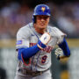 New York Mets center fielder Brandon Nimmo (9) runs to third on a triple in the fifth inning against the Colorado Rockies at Coors Field.