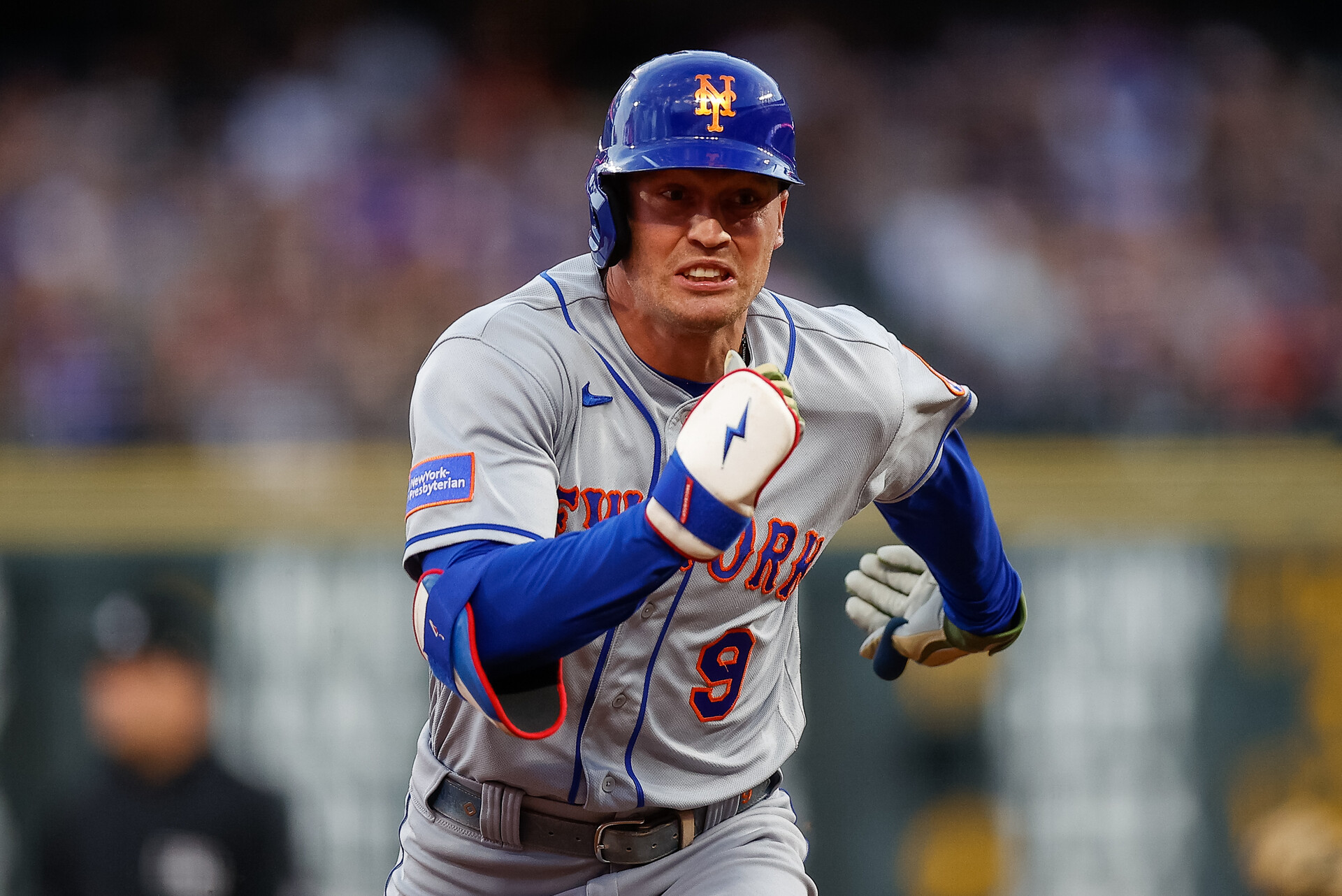New York Mets center fielder Brandon Nimmo (9) runs to third on a triple in the fifth inning against the Colorado Rockies at Coors Field.