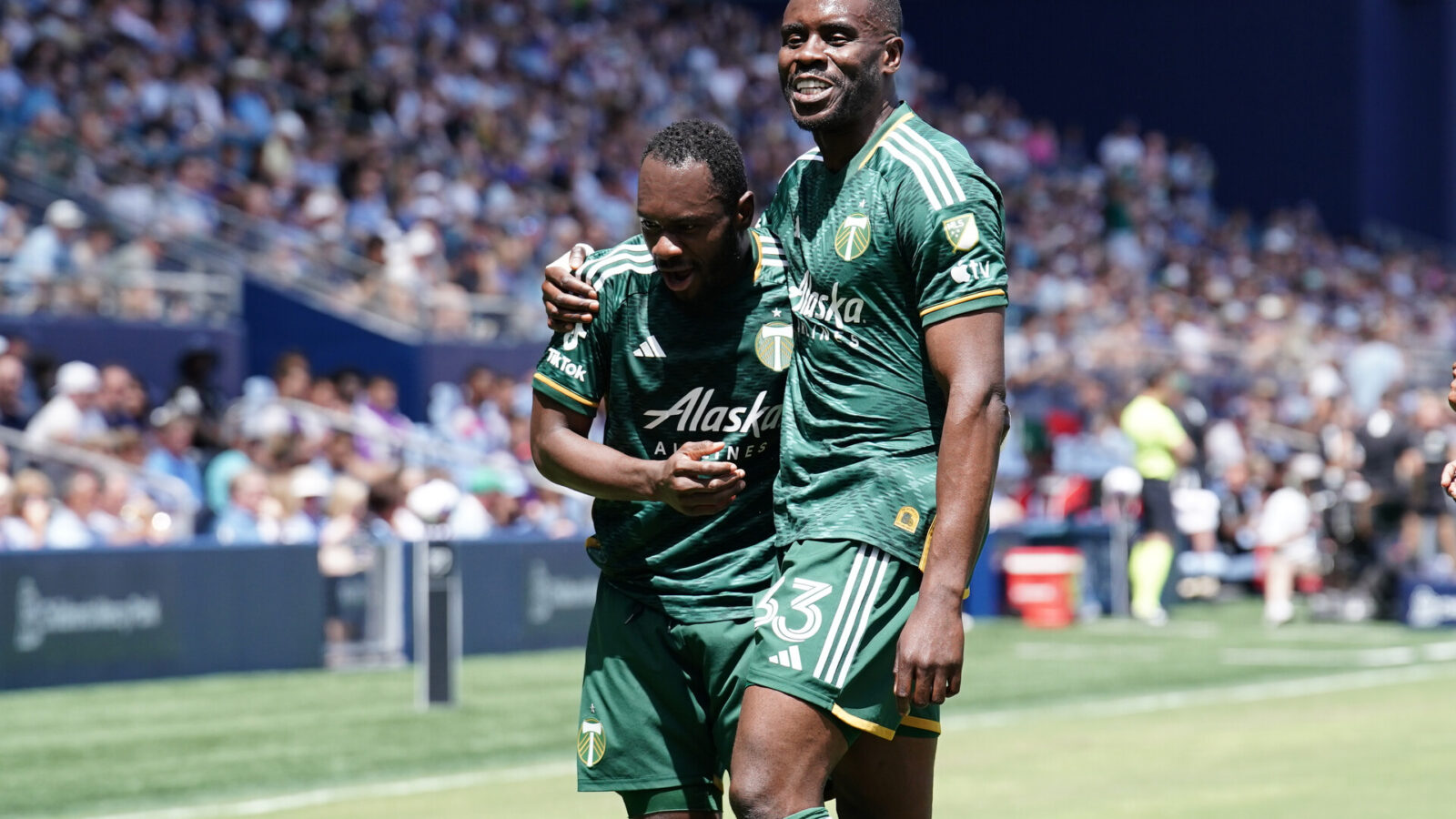 Portland Timbers forward Franck Boli (7) celebrates with Portland Timbers defender Larrys Mabiala (33) after scoring a goal against the Sporting Kansas City at Children's Mercy Park.