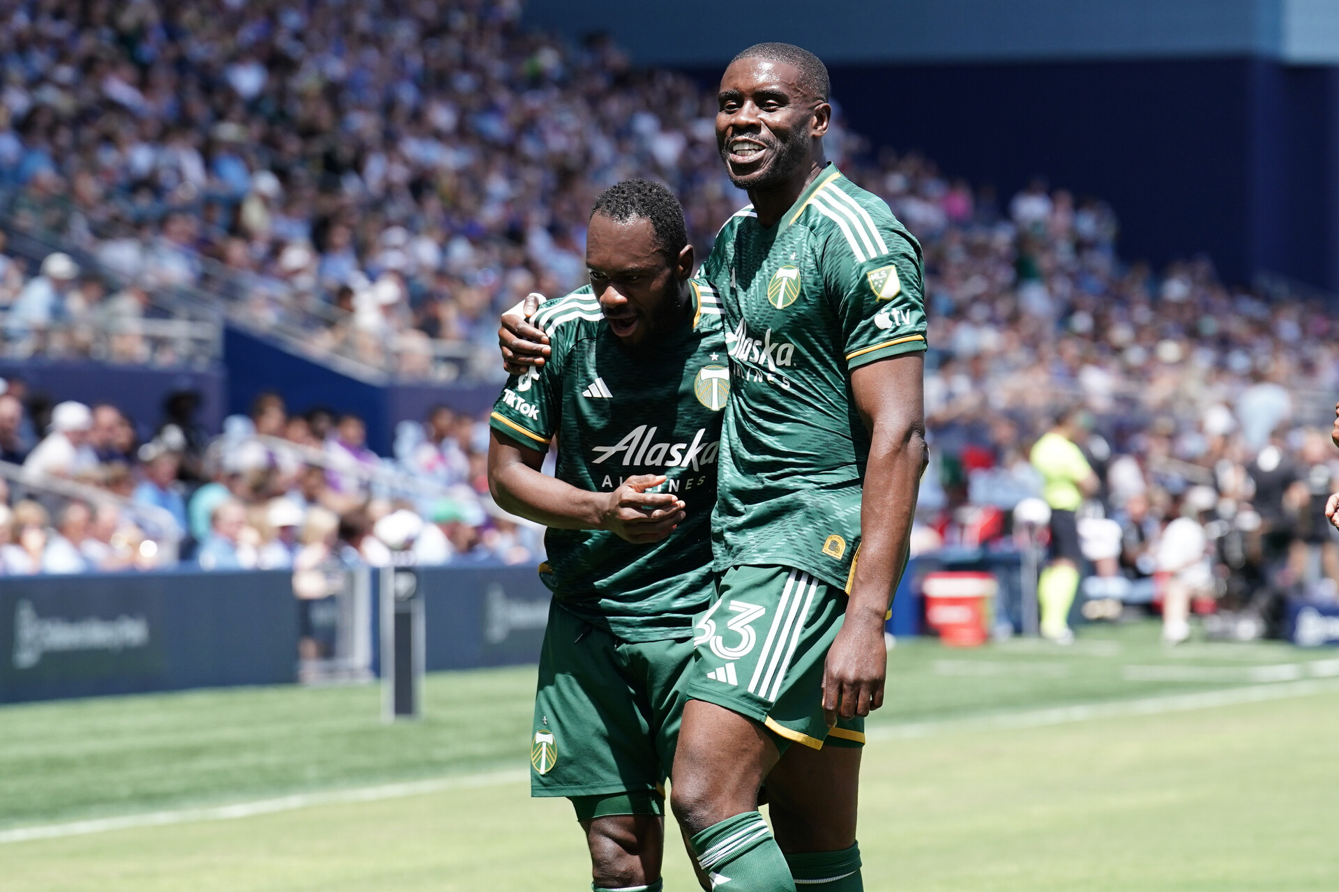 Portland Timbers forward Franck Boli (7) celebrates with Portland Timbers defender Larrys Mabiala (33) after scoring a goal against the Sporting Kansas City at Children's Mercy Park.
