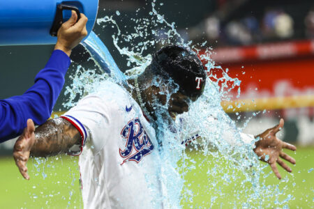 Jun 6, 2023; Arlington, Texas, USA; Texas Rangers starting pitcher Martin Perez (54) gives Texas Rangers right fielder Adolis Garcia (53) a Powerade bath after the game against the St. Louis Cardinals at Globe Life Field.