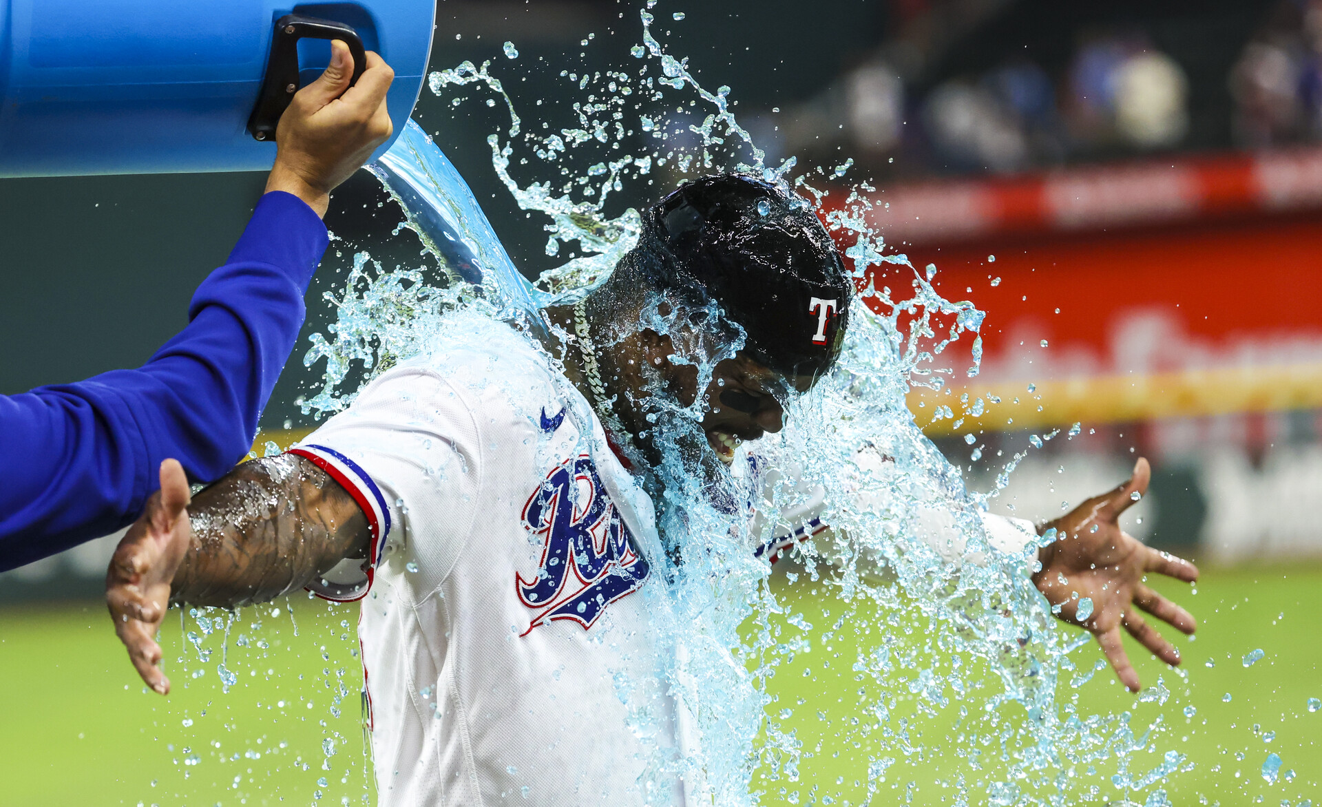 Jun 6, 2023; Arlington, Texas, USA; Texas Rangers starting pitcher Martin Perez (54) gives Texas Rangers right fielder Adolis Garcia (53) a Powerade bath after the game against the St. Louis Cardinals at Globe Life Field.