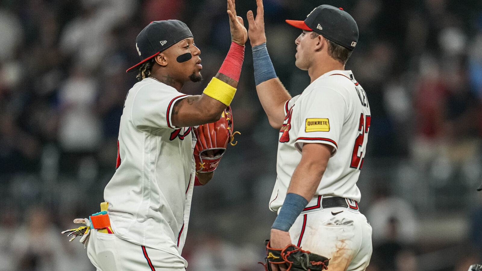 Jun 6, 2023; Cumberland, Georgia, USA; Atlanta Braves right fielder Ronald Acuna Jr. (13) reacts with third baseman Austin Riley (27) after the Braves defeated the New York Mets at Truist Park.