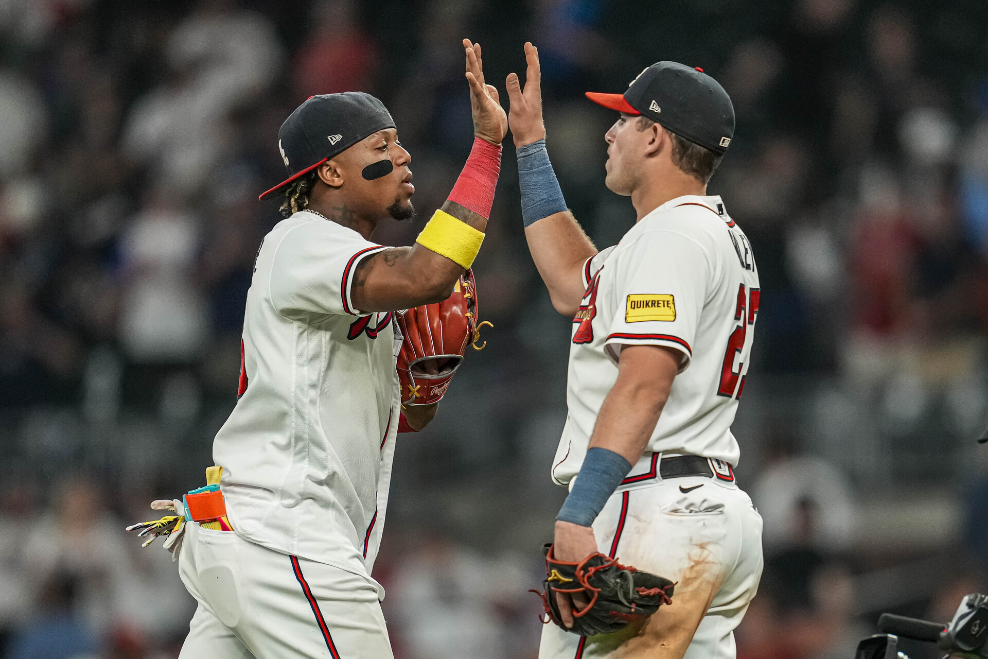 Jun 6, 2023; Cumberland, Georgia, USA; Atlanta Braves right fielder Ronald Acuna Jr. (13) reacts with third baseman Austin Riley (27) after the Braves defeated the New York Mets at Truist Park.