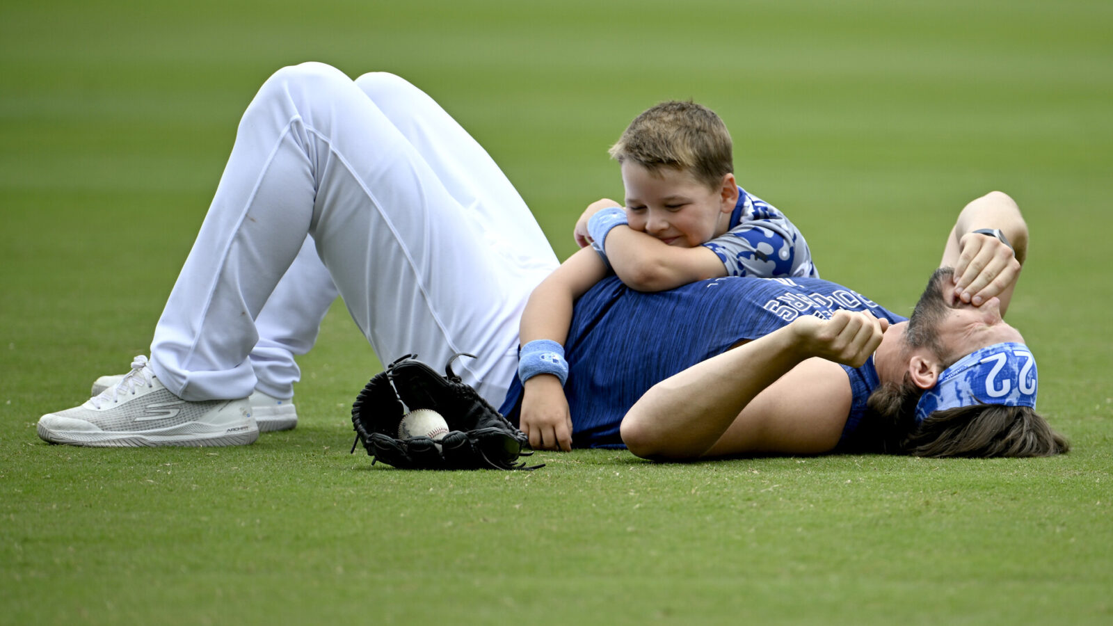Jun 18, 2023; Los Angeles, California, USA; Los Angeles Dodgers starting pitcher Clayton Kershaw (22) plays with his 6 year old son Charley prior to the game against the San Francisco Giants at Dodger Stadium.