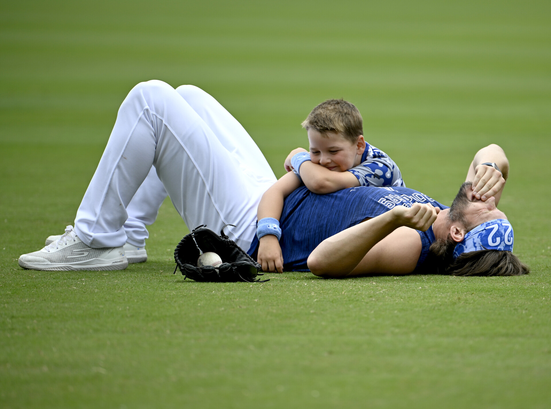Jun 18, 2023; Los Angeles, California, USA; Los Angeles Dodgers starting pitcher Clayton Kershaw (22) plays with his 6 year old son Charley prior to the game against the San Francisco Giants at Dodger Stadium.