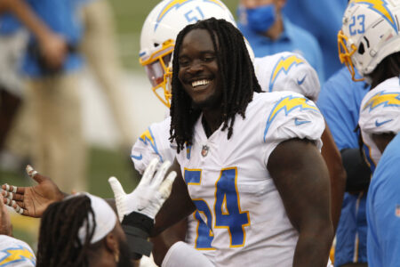 Los Angeles Chargers defensive end Melvin Ingram (54) celebrates after his fourth quarter interception against the Cincinnati Bengals during the second half at Paul Brown Stadium.