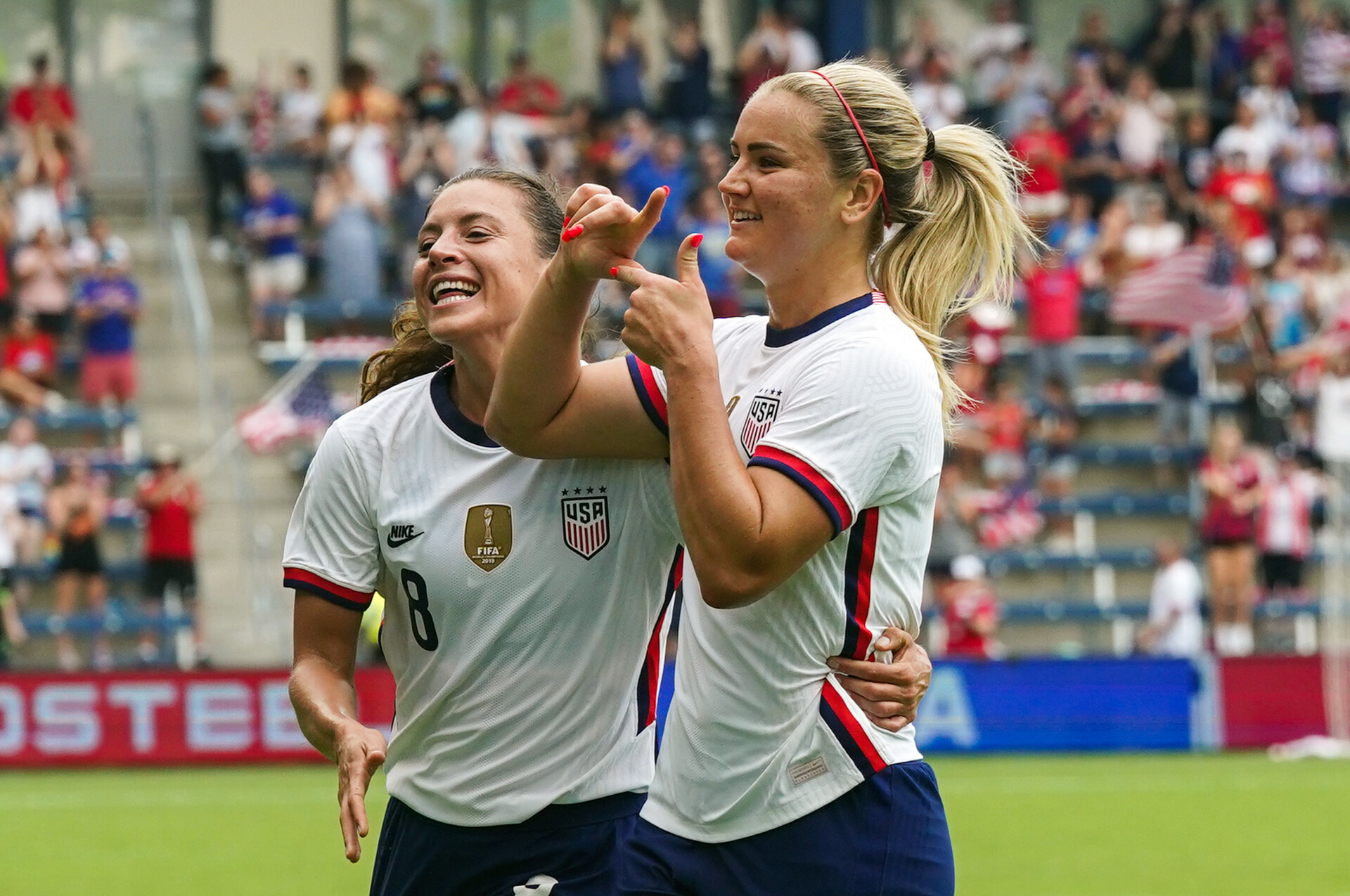 United States midfielder Lindsey Horan (10) celebrates with defender Sofia Huerta (8) after scoring a goal against Nigeria during the first half at Childrens Mercy Park.