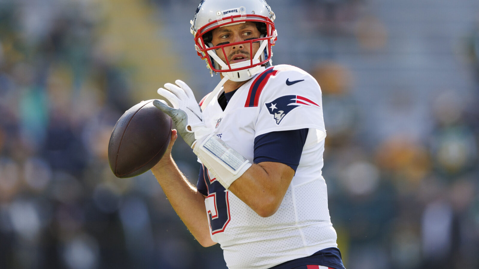 New England Patriots quarterback Brian Hoyer (5) throws a pass during warmups prior to the game against the Green Bay Packers at Lambeau Field.