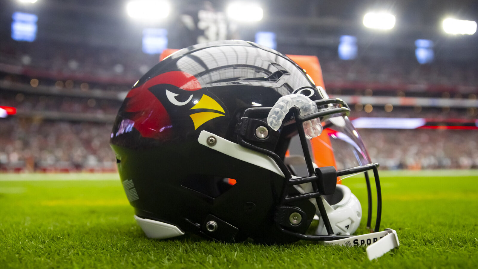 Oct 9, 2022; Glendale, Arizona, USA; Detailed view of a black Arizona Cardinals helmet on the field at State Farm Stadium.