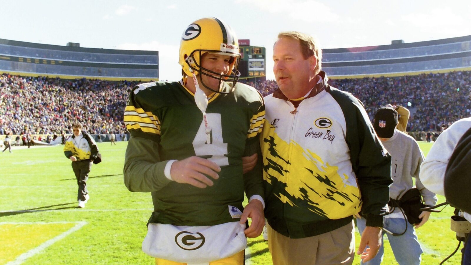 Green Bay Packers quarterback Brett Favre (4) and Green Bay Packers head coach Mike Holmgren walk off the field together after the victory of the Detroit Lions on Oct. 15, 1995 at Lambeau Field in Green Bay, Wis.