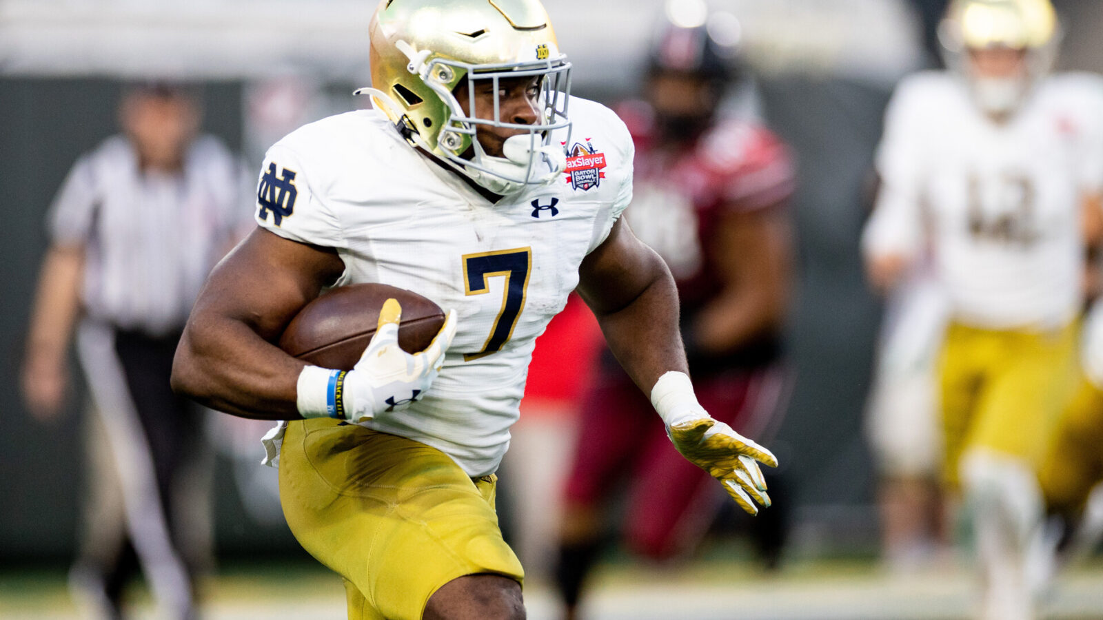 Dec 30, 2022; Jacksonville, FL, USA; Notre Dame Fighting Irish running back Audric Estime (7) runs with the ball during the first half against the South Carolina Gamecocks in the 2022 Gator Bowl at TIAA Bank Field.