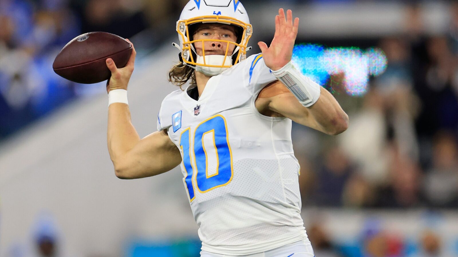 Los Angeles Chargers quarterback Justin Herbert (10) looks to throw during the first quarter of an NFL first round playoff football matchup Saturday, Jan. 14, 2023 at TIAA Bank Field in Jacksonville, Fla. The Jacksonville Jaguars edged the Los Angeles Chargers on a field goal 31-30.
