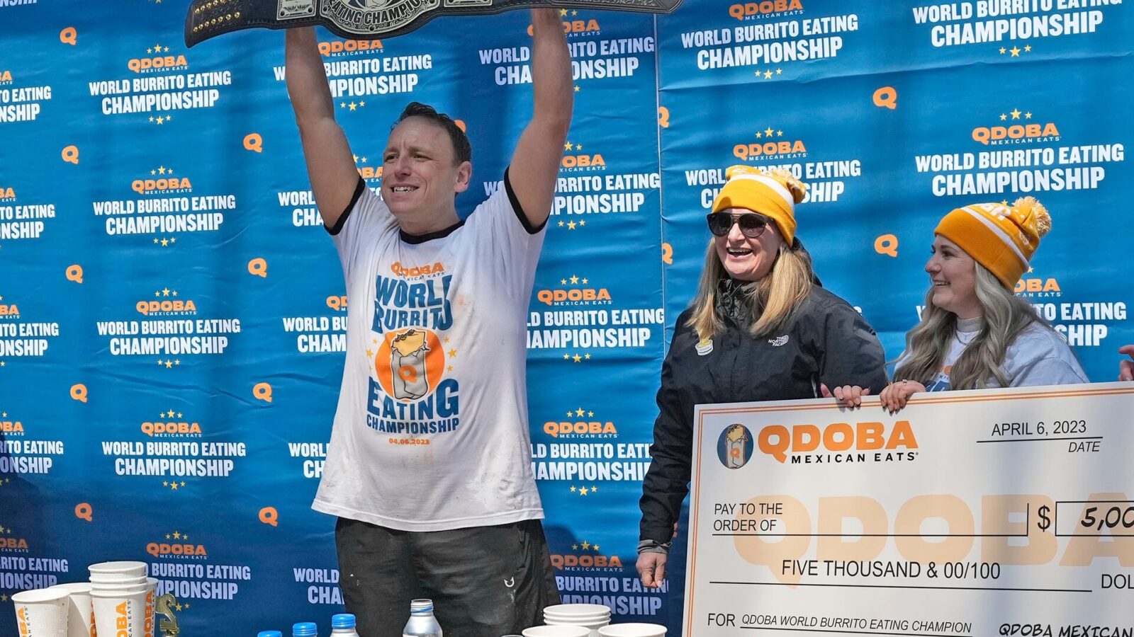 World Champion Competitive Eater Joey Chestnut reacts to winning the World Burrito Eating Contest with Qdoba representatives at the Beer Garden in Deer District in Milwaukee on Thursday, April 6, 2023. The event, hosted by Qdoba, coinciding with National Burrito Day, included Chestnut and other contestants competing to consume as many Qdoba burritos as possible during a 10-minute window for prize money.