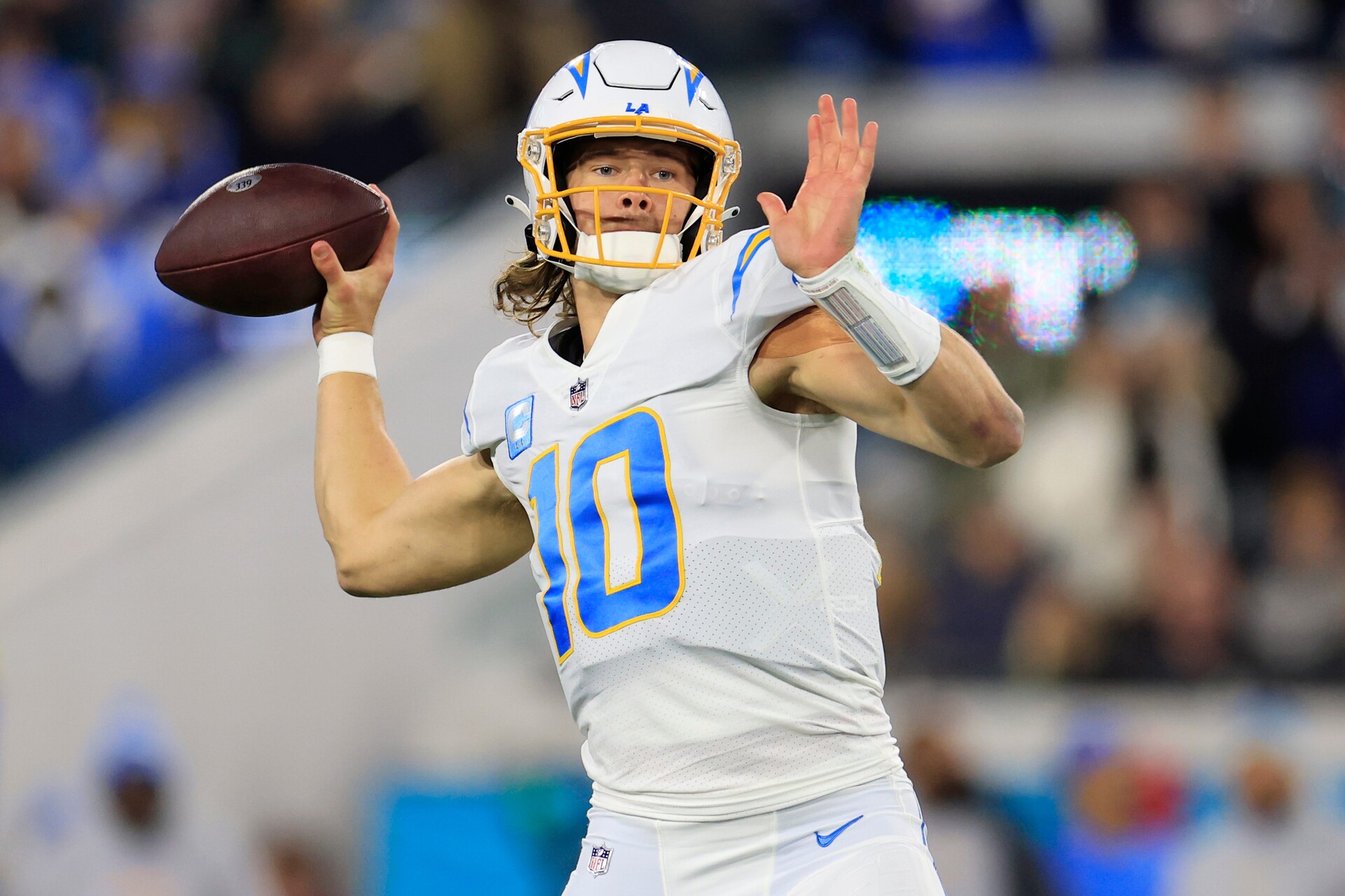 Chargers quarterback Justin Herbert looks to throw during the first quarter of an NFL first round playoff game against the Jaguars.