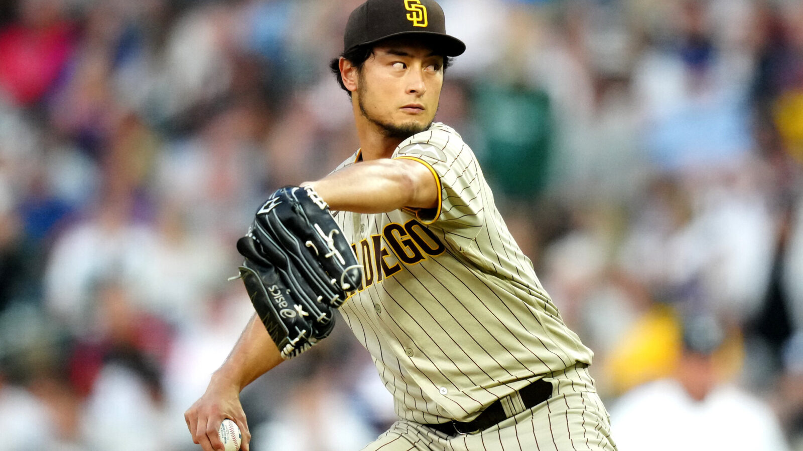 Jun 9, 2023; Denver, Colorado, USA; San Diego Padres starting pitcher Yu Darvish (11) delivers a pitch in the fifth inning against the Colorado Rockies at Coors Field.