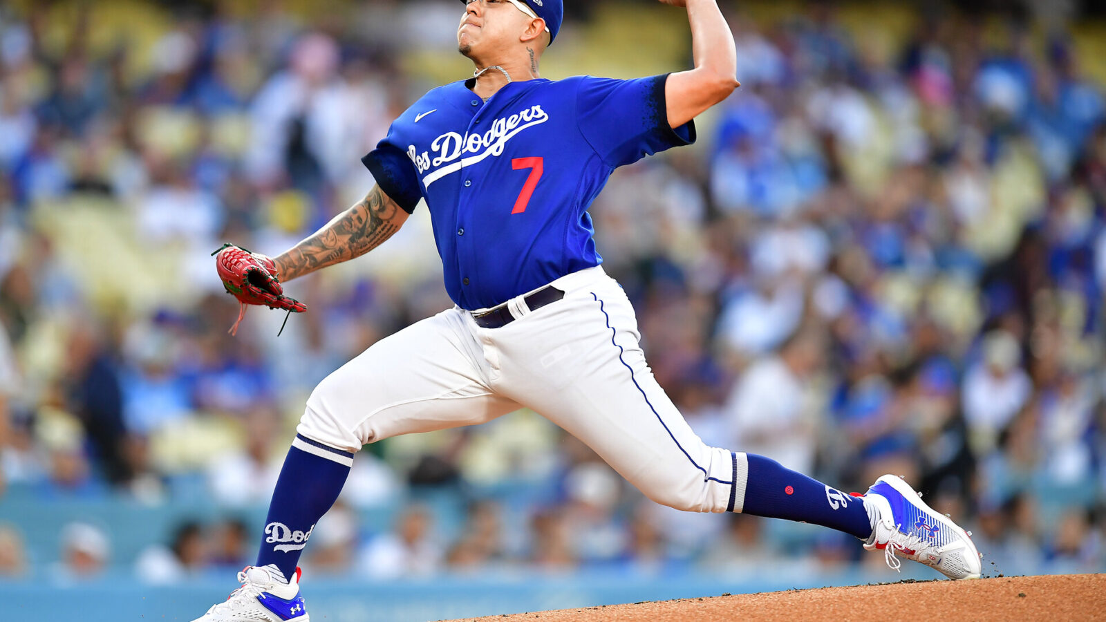 Jul 6, 2023; Los Angeles, California, USA; Los Angeles Dodgers starting pitcher Julio Urias (7) throws against the Pittsburgh Pirates during the first inning at Dodger Stadium.