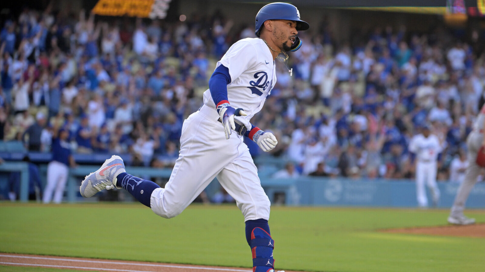 Jul 8, 2023; Los Angeles, California, USA; Los Angeles Dodgers right fielder Mookie Betts (50) rounds first after hitting a lead off solo home run in the first inning against the Los Angeles Angels at Dodger Stadium.