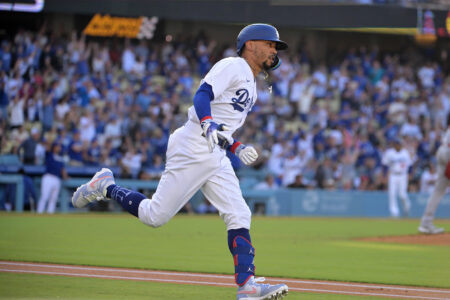 Jul 8, 2023; Los Angeles, California, USA; Los Angeles Dodgers right fielder Mookie Betts (50) rounds first after hitting a lead off solo home run in the first inning against the Los Angeles Angels at Dodger Stadium.