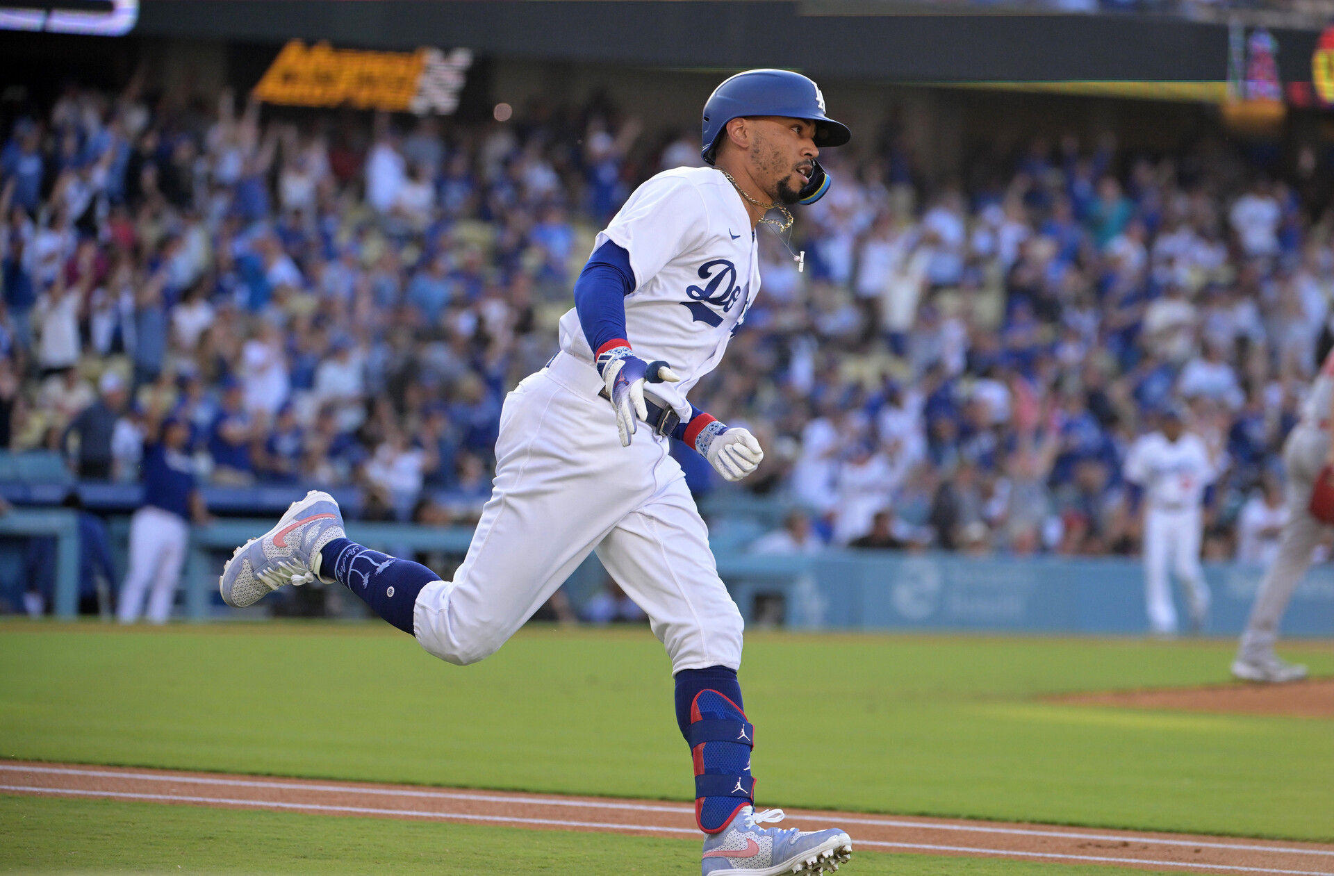 Jul 8, 2023; Los Angeles, California, USA; Los Angeles Dodgers right fielder Mookie Betts (50) rounds first after hitting a lead off solo home run in the first inning against the Los Angeles Angels at Dodger Stadium.