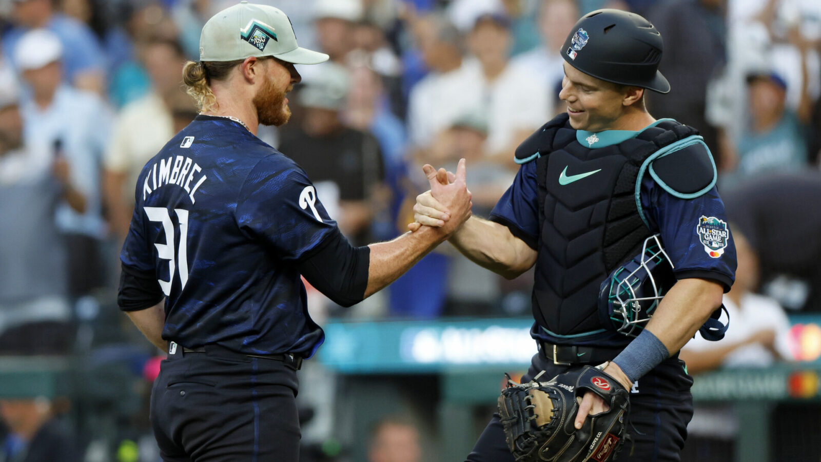 Jul 11, 2023; Seattle, Washington, USA; National League pitcher Craig Kimbrel of the Philadelphia Phillies (31) celebrates with catcher Will Smith of the Los Angeles Dodgers (16) after winning the 2023 MLB All Star Game at T-Mobile Park.