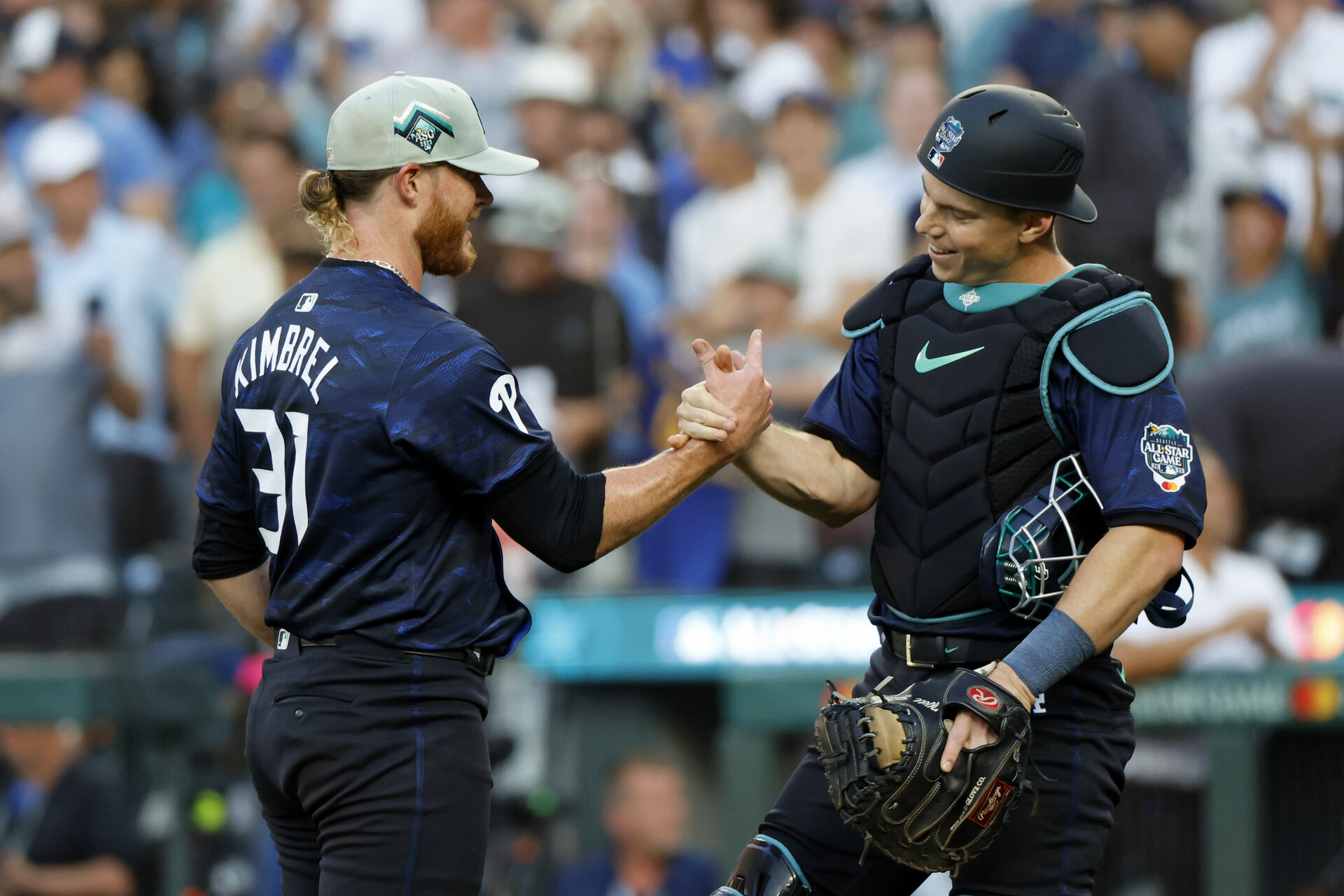 Jul 11, 2023; Seattle, Washington, USA; National League pitcher Craig Kimbrel of the Philadelphia Phillies (31) celebrates with catcher Will Smith of the Los Angeles Dodgers (16) after winning the 2023 MLB All Star Game at T-Mobile Park.