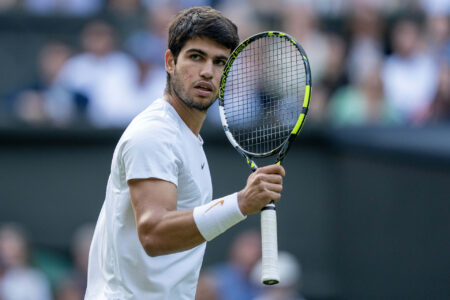 Jul 12, 2023; London, United Kingdom; Carlos Alcaraz (ESP) reacts to a point during his match against Holger Rune (DEN) on day ten of Wimbledon at the All England Lawn Tennis and Croquet Club.