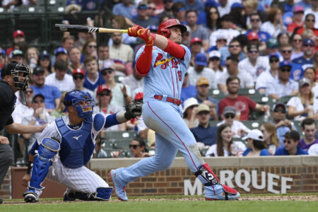 Jul 22, 2023; Chicago, Illinois, USA; St. Louis Cardinals second baseman Nolan Gorman (16) hits a solo home run against the Chicago Cubs during the fifth inning at Wrigley Field.