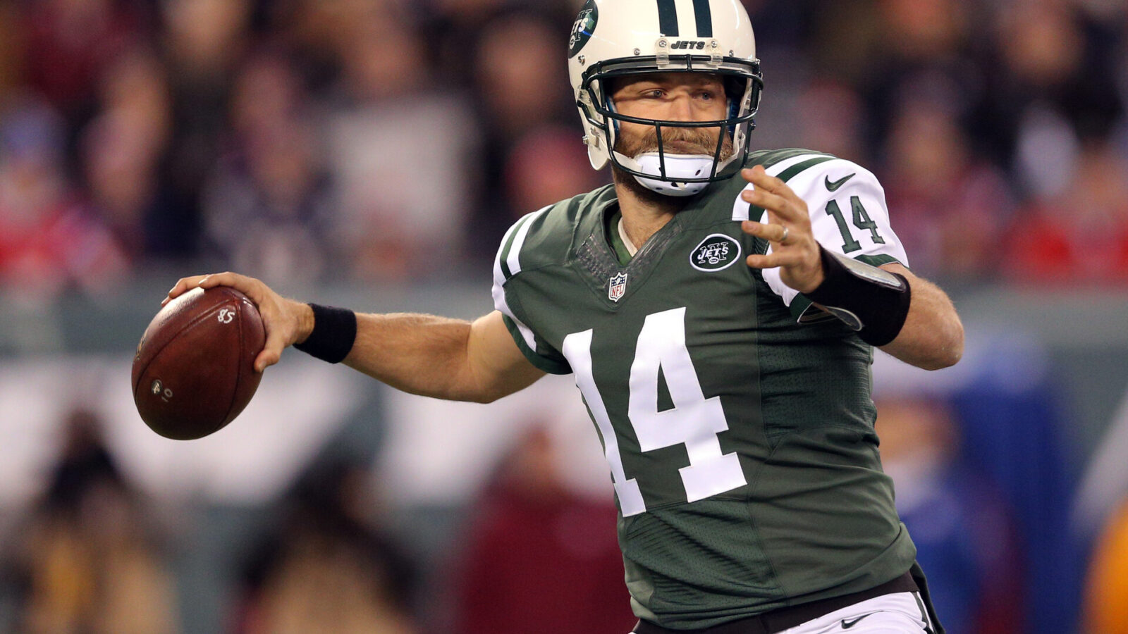 New York Jets quarterback Ryan Fitzpatrick (14) prepares to throw the ball against the New England Patriots during the first quarter at MetLife Stadium.