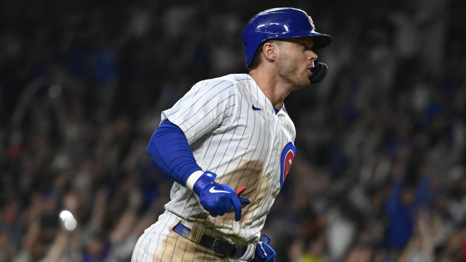 Jul 19, 2023; Chicago, Illinois, USA; Chicago Cubs second baseman Nico Hoerner (2) runs the bases after he his a grand slam against the Washington Nationals during the eighth inning at Wrigley Field.