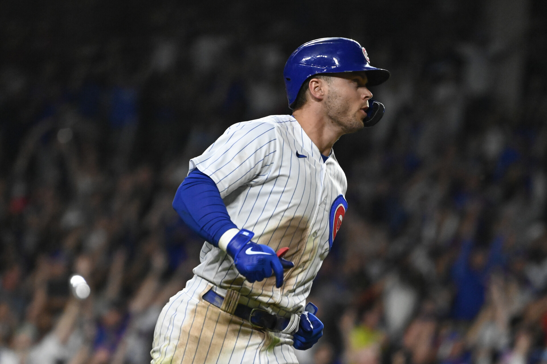Jul 19, 2023; Chicago, Illinois, USA; Chicago Cubs second baseman Nico Hoerner (2) runs the bases after he his a grand slam against the Washington Nationals during the eighth inning at Wrigley Field.