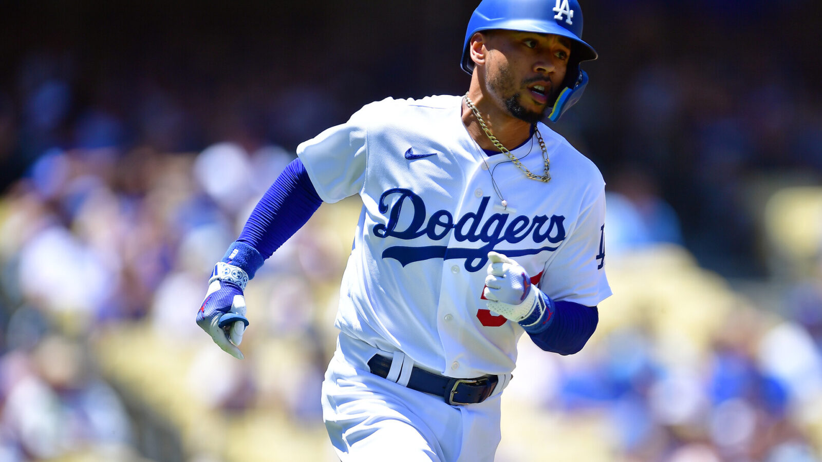 Jul 26, 2023; Los Angeles, California, USA; Los Angeles Dodgers right fielder Mookie Betts (50) runs after hitting a single against the Toronto Blue Jays during the first inning at Dodger Stadium.