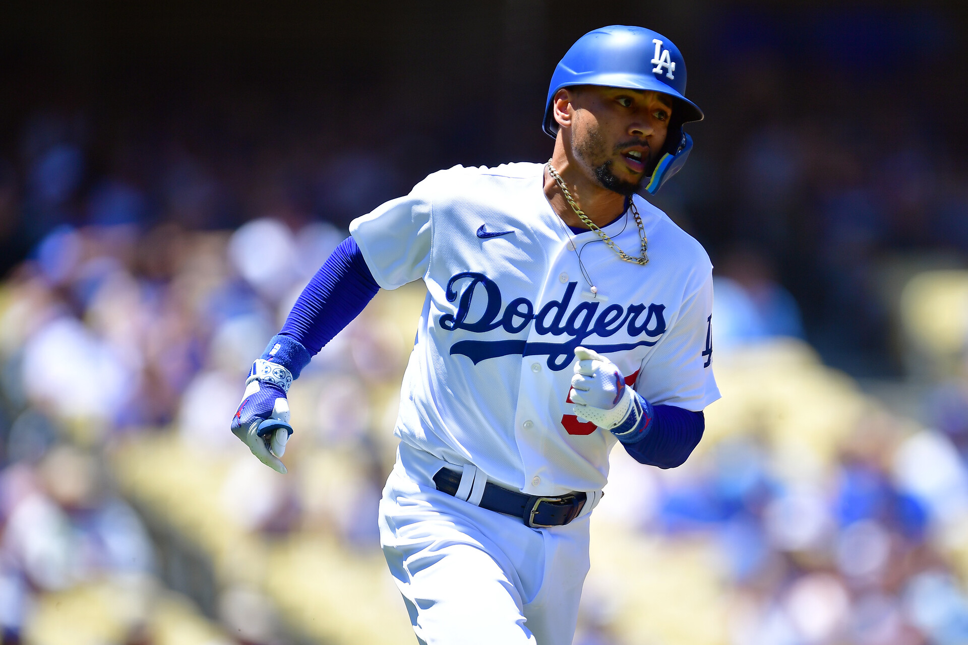 Jul 26, 2023; Los Angeles, California, USA; Los Angeles Dodgers right fielder Mookie Betts (50) runs after hitting a single against the Toronto Blue Jays during the first inning at Dodger Stadium.