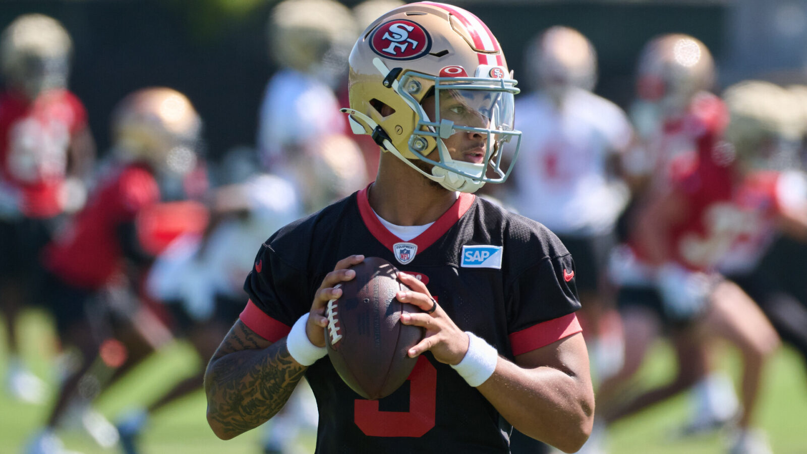San Francisco 49ers quarterback Trey Lance (5) drops back to throw a pass during training camp at the SAP Performance Facility.