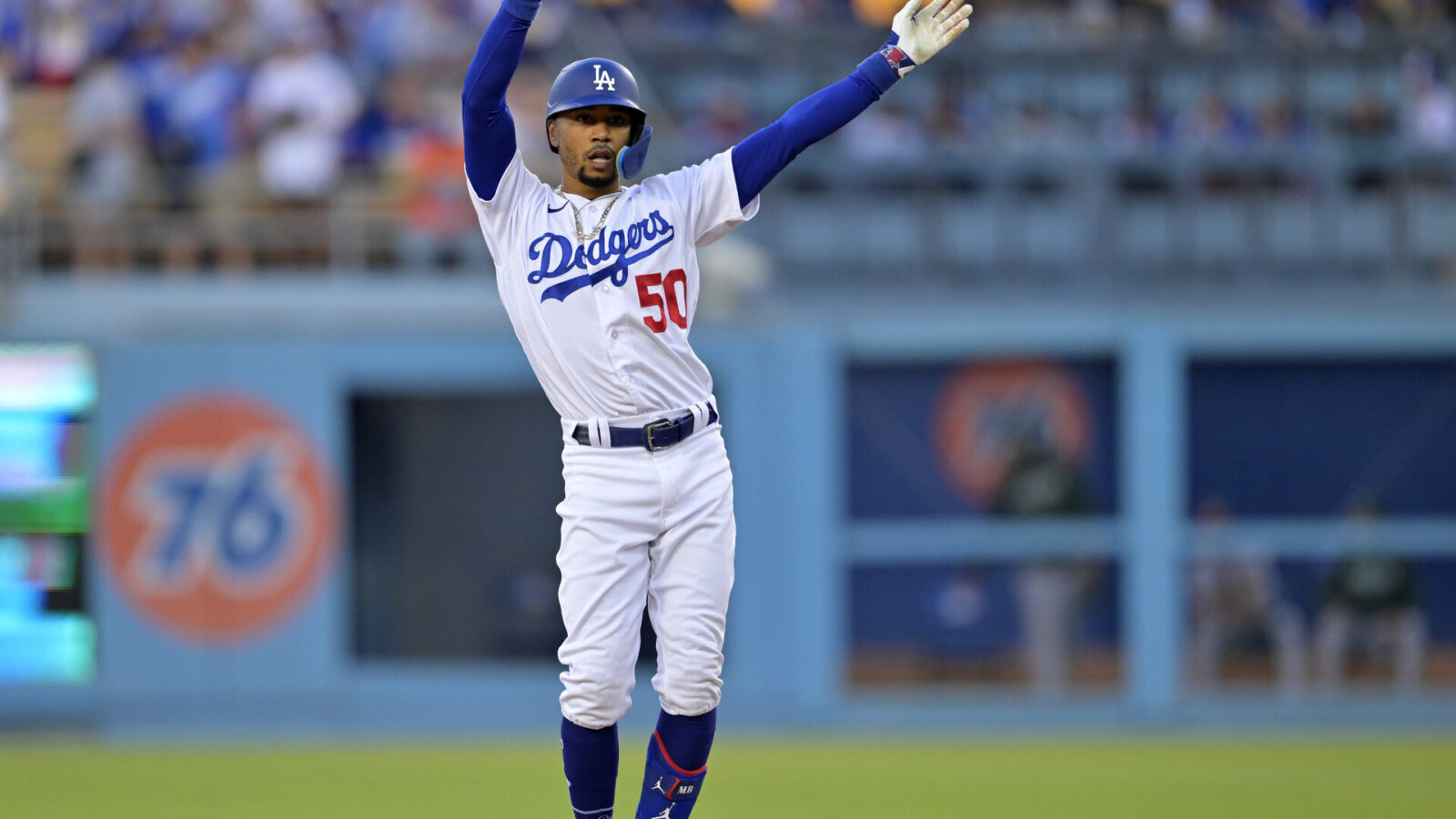 Aug 2, 2023; Los Angeles, California, USA; Los Angeles Dodgers right fielder Mookie Betts (50) does the ÒFreddie DanceÓ, for first baseman Freddie Freeman (not pictured) after hitting a double in the first inning against the Oakland Athletics at Dodger Stadium.