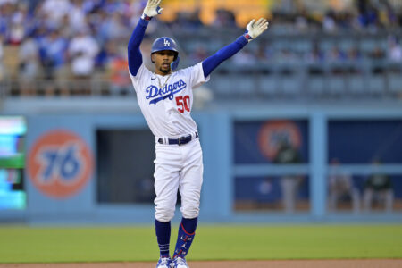 Aug 2, 2023; Los Angeles, California, USA; Los Angeles Dodgers right fielder Mookie Betts (50) does the ÒFreddie DanceÓ, for first baseman Freddie Freeman (not pictured) after hitting a double in the first inning against the Oakland Athletics at Dodger Stadium.