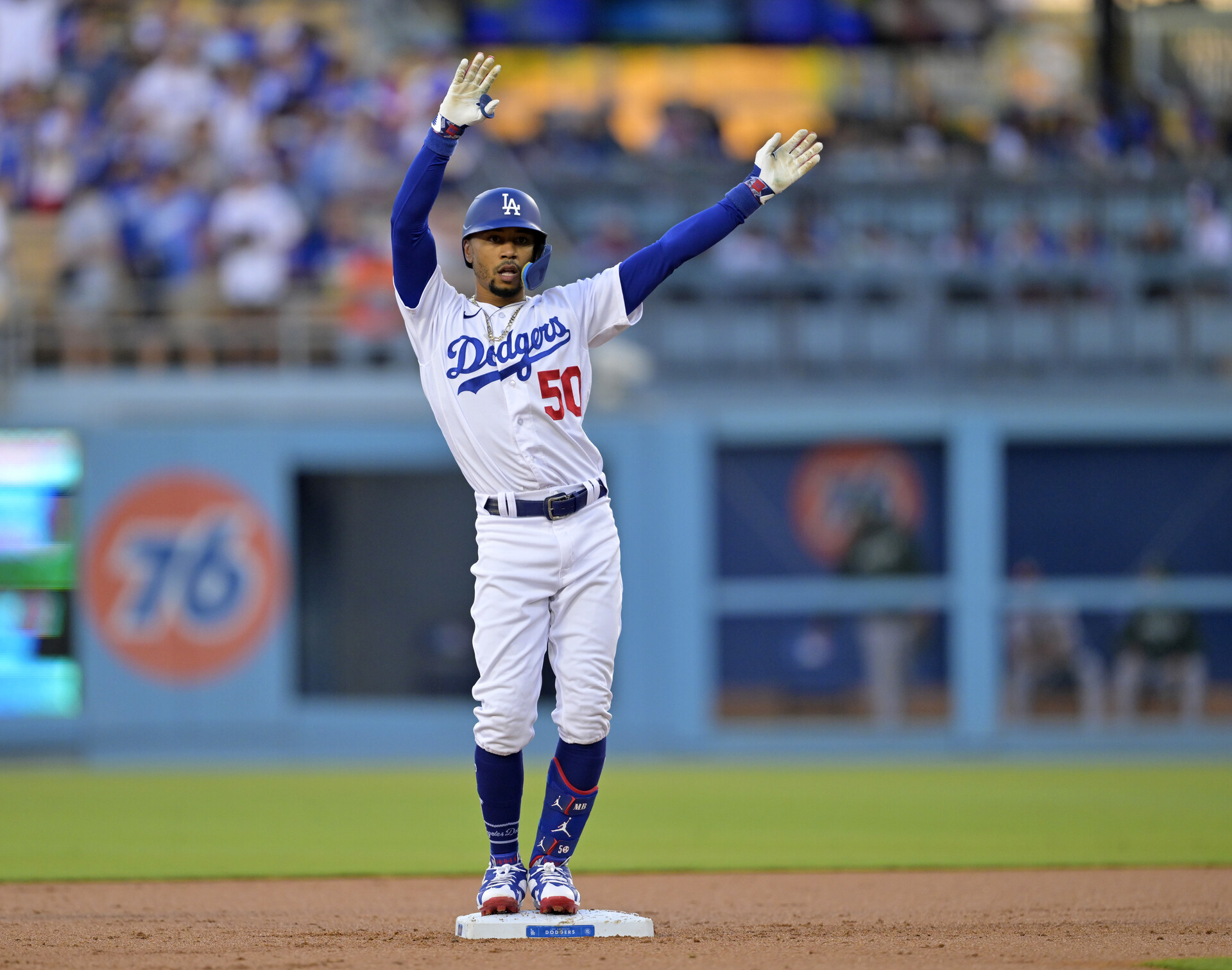 Aug 2, 2023; Los Angeles, California, USA; Los Angeles Dodgers right fielder Mookie Betts (50) does the ÒFreddie DanceÓ, for first baseman Freddie Freeman (not pictured) after hitting a double in the first inning against the Oakland Athletics at Dodger Stadium.