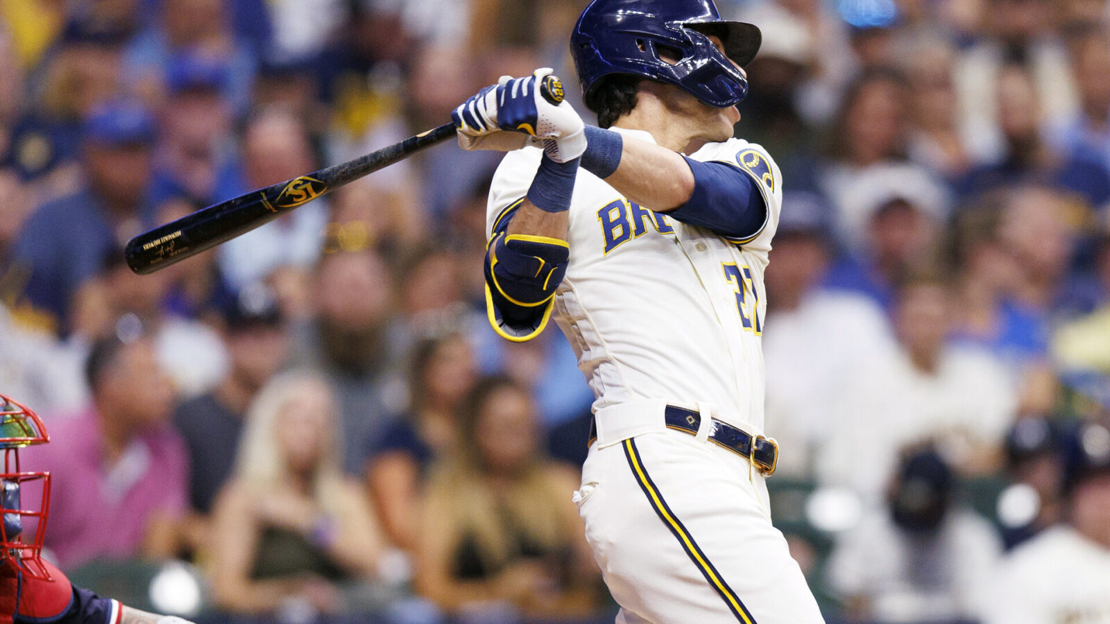 Aug 22, 2023; Milwaukee, Wisconsin, USA; Milwaukee Brewers left fielder Christian Yelich (22) hits a double during the third inning against the Minnesota Twins at American Family Field.