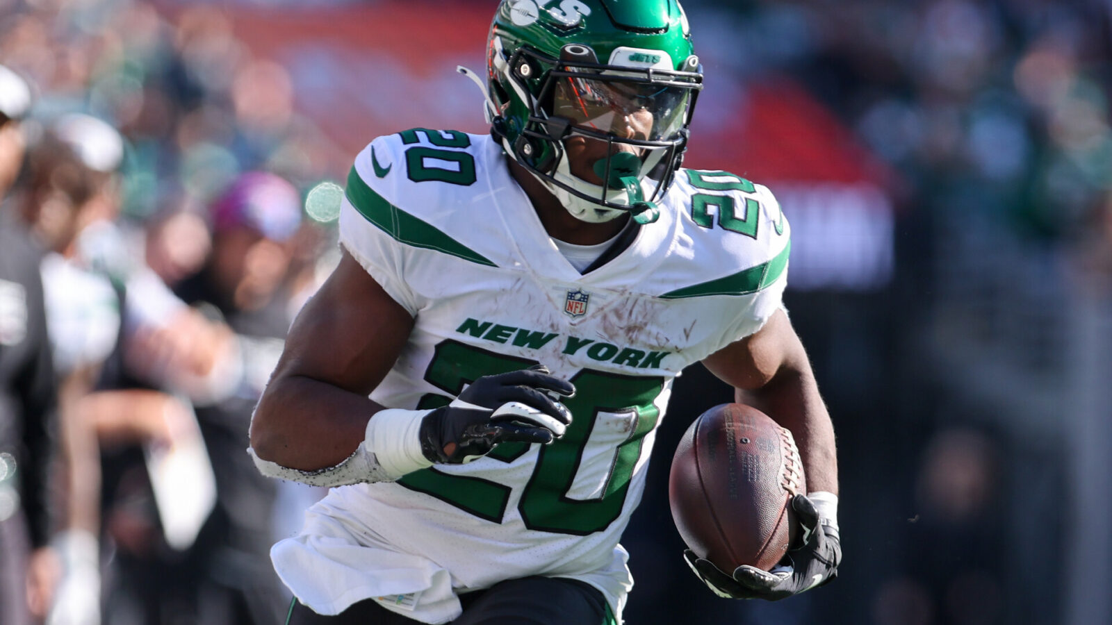 Oct 9, 2022; East Rutherford, New Jersey, USA; New York Jets running back Breece Hall (20) runs with the ball against the Miami Dolphins during the second half at MetLife Stadium.