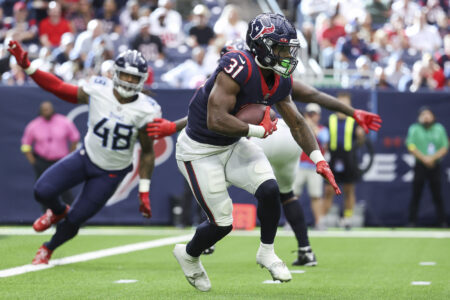 Oct 30, 2022; Houston, Texas, USA; Houston Texans running back Dameon Pierce (31) runs with the ball during the game against the Tennessee Titans at NRG Stadium.